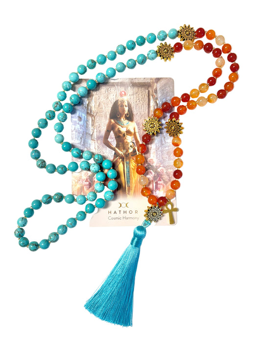 Goddess Hathor mala necklace with carnelian and turquoise beads and a sky blue tassel on a white background